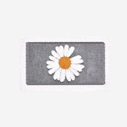 Saugfähige Badematte mit Gänseblümchen-Motiv