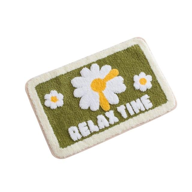 Grüne Badematte mit Gänseblümchen Motiv