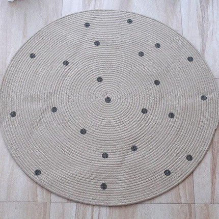 Runder Jute-Teppich mit schwarzen Punkten